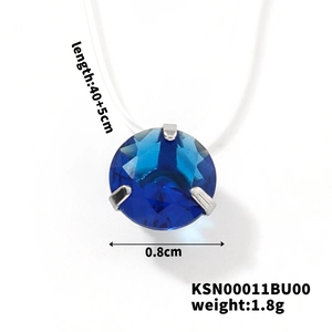 Detail of blue cubic zirconia pendant with 3-prong setting on invisible fishing line chain