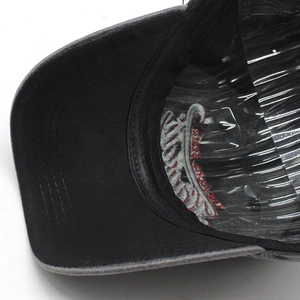Close-up of baseball cap interior showing reinforced stitching and plastic shape support