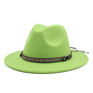 Detail of bright green wool fedora with ethnic geometric band and leather buckle