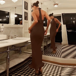 Detail view showing the elegant backless design and halter neckline of the brown maxi dress