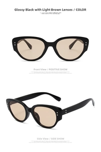 Detail view of black cat-eye sunglasses with light tea lenses and silver rivet accents