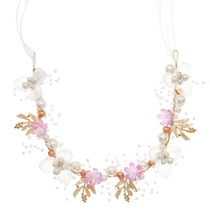 Detail of bridal headband with gold leaves, pink flowers, and white pearls on ribbon