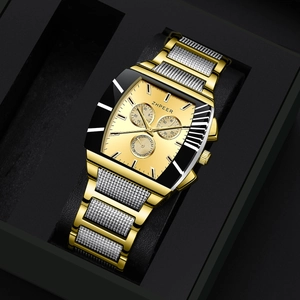 Close-up of luxury gold and silver mesh strap chronograph watch inside a black gift box