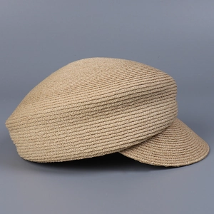 Side view of high-quality raffia straw newsboy cap with fine woven texture and brim