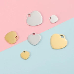 Polished heart-shaped stainless steel pendants in gold and silver, assorted sizes