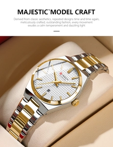Detail of two-tone stainless steel watch with calendar display on a beige leather box
