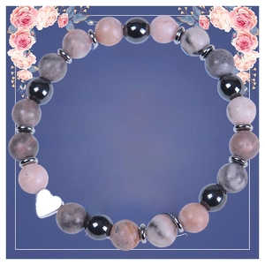 Detail view of natural stone soul sister bracelet with silver heart charm and floral card