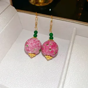 Retro Neo-Chinese style long drop earrings with pink ceramic beads and gold accents