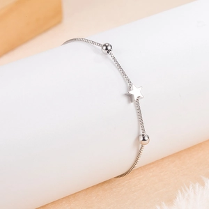 Minimalist silver beaded chain bracelet featuring star charms and round metal beads