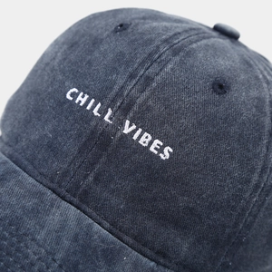 Macro detail of Chill Vibes 3D embroidery on washed cotton twill baseball cap