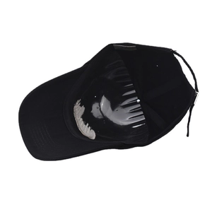 Detailed interior of a black cotton baseball cap with adjustable silver metal buckle