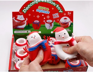 Detailed view of festive snowman squeeze toys showing soft texture and holiday designs