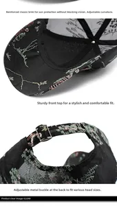 Close-up of pink flower embroidery and adjustable metal buckle on black baseball cap