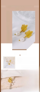 Detailed close-up of leaf-shaped titanium steel earrings with natural freshwater pearls
