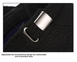 Detail of adjustable metal buckle and thick knit fabric on men's winter peaked cap