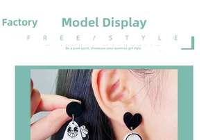 Close-up of Halloween rubber hose style ghost earrings worn by a model in a detail view