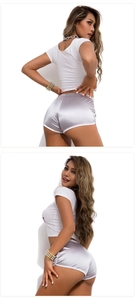Detail of silver satin athletic shorts featuring white trim and silky glossy texture