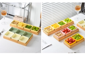 Detail of square ceramic snack bowls in pastel colors on a bamboo wooden serving tray
