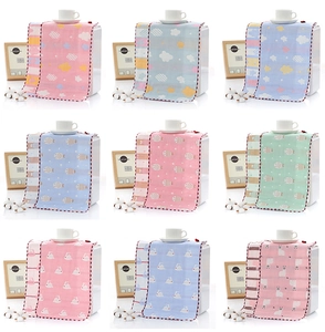 Collage of multi-colored cotton gauze towels with cute cartoon animal prints for babies