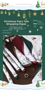 Close-up of Christmas wrapping paper with festive pine, berry and bird hand-drawn patterns