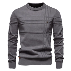 Close-up of men's dark grey crew neck sweater showing detailed knit texture and ribbing