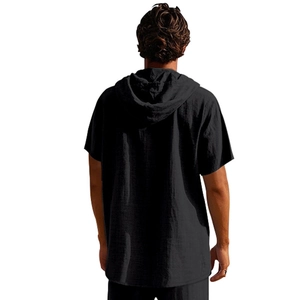 Rear view of black linen short sleeve hoodie showing texture and loose beach style fit