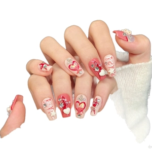 Handmade press-on nails with 3D brave letters, pink hearts and pearls in punk style