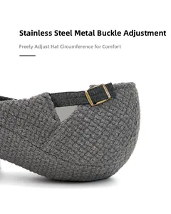 Detailed macro view of the adjustable bronze stainless steel buckle on a grey knitted cap