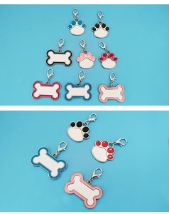 Detail of bone and paw shaped sublimation pet tags with colorful enamel and lobster clasps