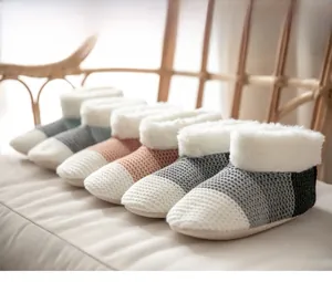 Close-up of cozy knit winter floor socks with warm white faux fur lining and non-slip sole