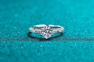 Macro shot of S925 sterling silver ring with moissanite main stone and twisted diamond band