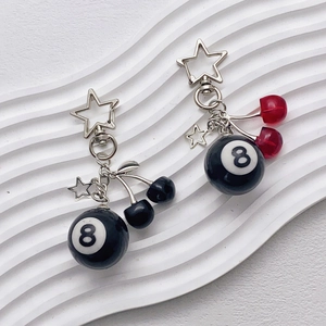 Metal cherry keychain with black No. 8 pool ball and star pendants on white background