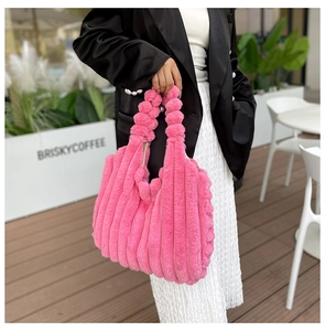 Detail of rose pink faux fur tote bag with vertical ribs and ruffled handle strap