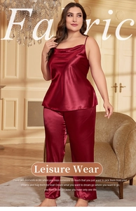 Detail of burgundy satin pajama set featuring silk camisole top and loose trousers