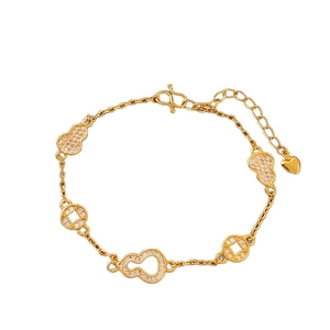 Bracelet plaqué or avec gourdes en zircon et pièces anciennes dans une vue circulaire