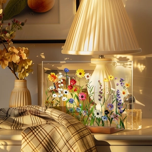 Detailed shot of clear acrylic rectangle with dried flowers on a wooden base decor