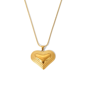 Golden heart pendant necklace with snake chain and decorative beaded edge texture