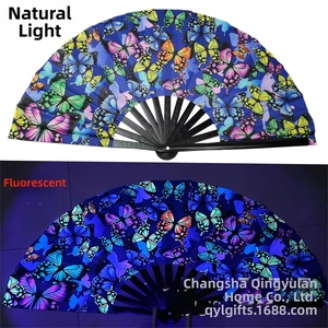 Detail showing foldable butterfly fan colors under natural light and fluorescent glow