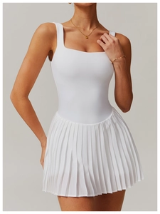 Detailed view of the square neck and pleated hem on this white sleeveless athletic dress