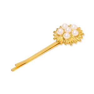 Golden sunflower hair clip with white pearls on a polished stainless steel band