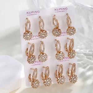Set of 6 pairs of rose gold earrings with cubic zirconia charms on display card