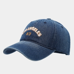 Washed dark blue denim baseball cap with Los Angeles 83 embroidery in 3/4 view