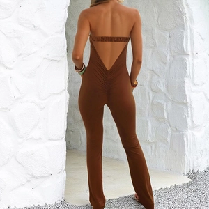 Detailed back view of a brown backless jumpsuit with ruched accents on the buttocks