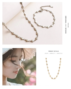 Detailed set of silver and gold petal chain necklace and bracelet on model