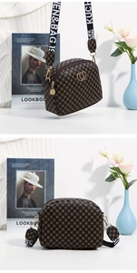 Macro detail of brown monogram handbag featuring gold double-heart buckle and woven strap