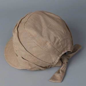 Detail of breathable linen cotton baseball cap with textured weave and rear tie