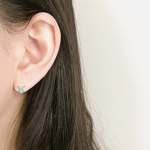 Cute S925 silver rabbit stud earrings with green jade beads worn on ear lobe