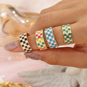 Minimalist wide stainless steel checkered rings in gold finish with colorful patterns