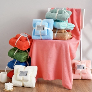 Absorbent coral fleece towel and bath towel set tied with ribbons in various colors
