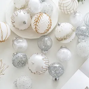 Champagne and silver Christmas ball ornaments with glitter and feather filler